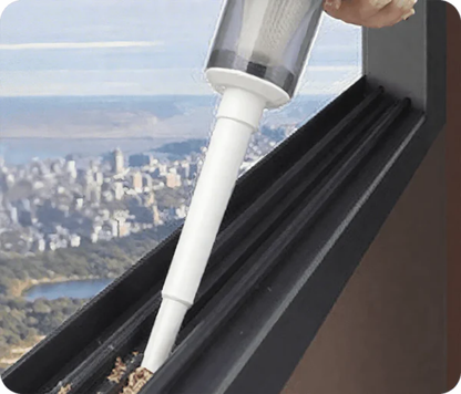 Handheld vacuum attachment cleaning a window track